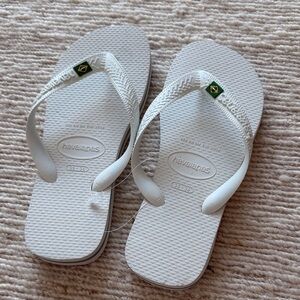 Havaianas White Flip Flops with Green and Yellow Brazil Flag Detail